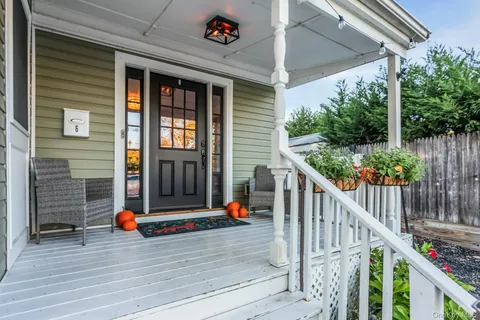a bedroom with a bed and a view of walk in closet