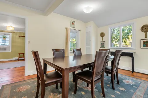 a view of a refrigerator in kitchen and wooden floor