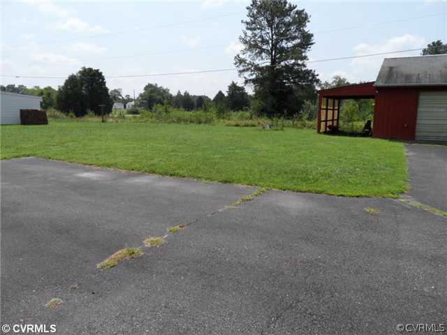 25419 Front Road Petersburg, VA 23803 - Photo 3 of 4 a view of a house with a backyard