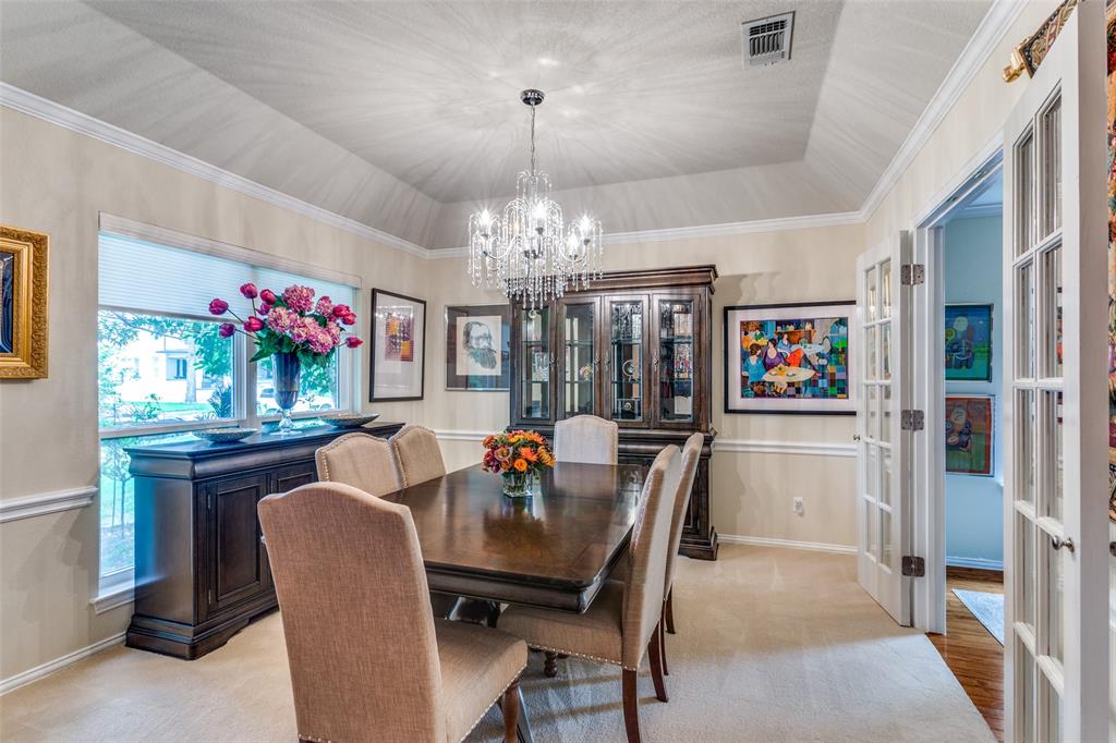 2229 Weatherbee Street Fort Worth, TX 76110 - Photo 5 of 25 Dining space featuring french doors, plenty of natural light, a notable chandelier, and visible vents
