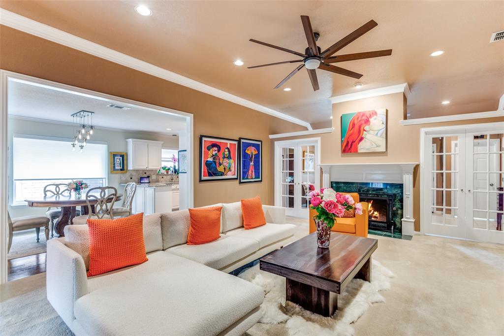 2229 Weatherbee Street Fort Worth, TX 76110 - Photo 8 of 25 Living room with crown molding, recessed lighting, french doors, a ceiling fan, and a premium fireplace
