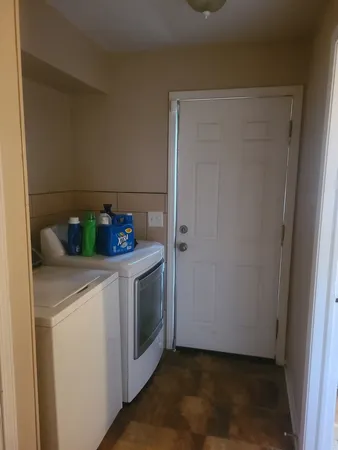 a utility room with washer and dryer