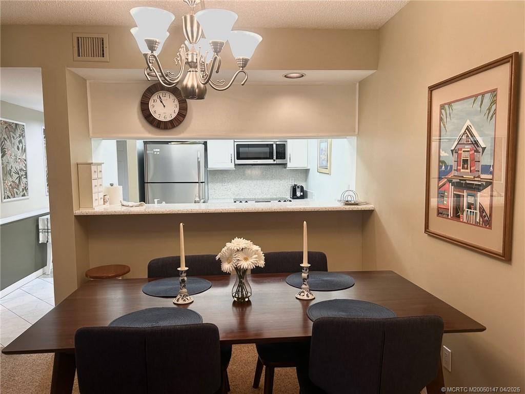 5811 Northeast Gulfstream Way, Unit 4002 Stuart, FL 34996 - Photo 20 of 39 a view of a workspace with furniture