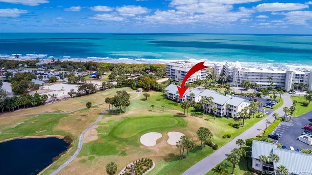 an aerial view of residential house with outdoor space and pool