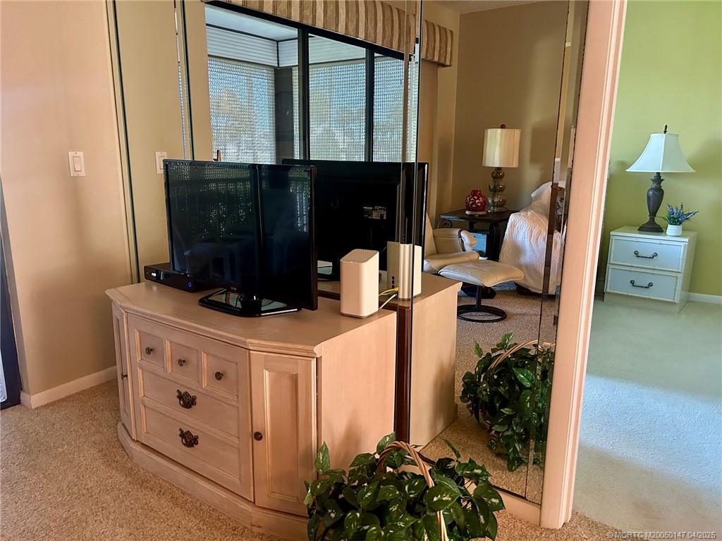 5811 Northeast Gulfstream Way, Unit 4002 Stuart, FL 34996 - Photo 22 of 39 a bathroom with a sink and a mirror