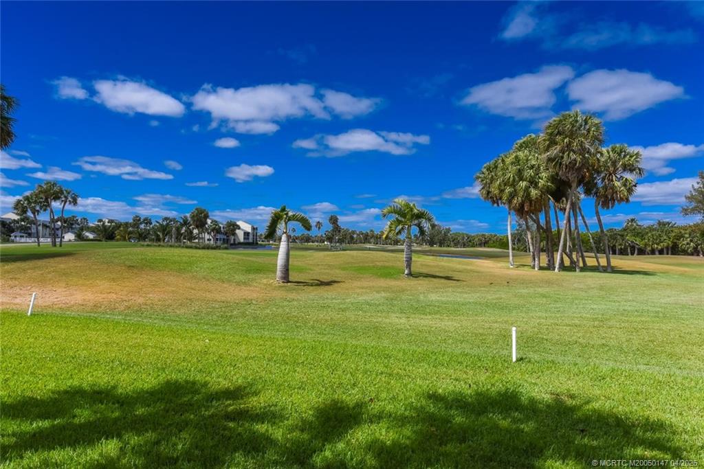 5811 Northeast Gulfstream Way, Unit 4002 Stuart, FL 34996 - Photo 25 of 39 a view of a lake with a big yard