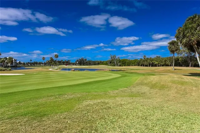 a view of a chairs and tables in the patio