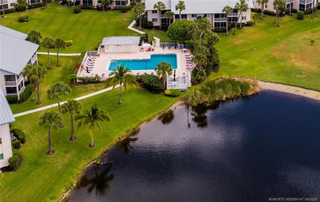5811 Northeast Gulfstream Way, Unit 4002 Stuart, FL 34996 - Photo 30 of 39 an aerial view of a house with a garden and lake view