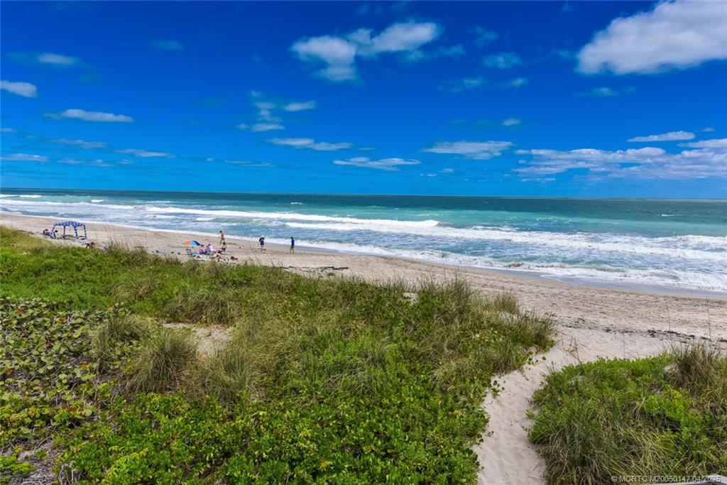 5811 Northeast Gulfstream Way, Unit 4002 Stuart, FL 34996 - Photo 32 of 39 a view of an ocean beach