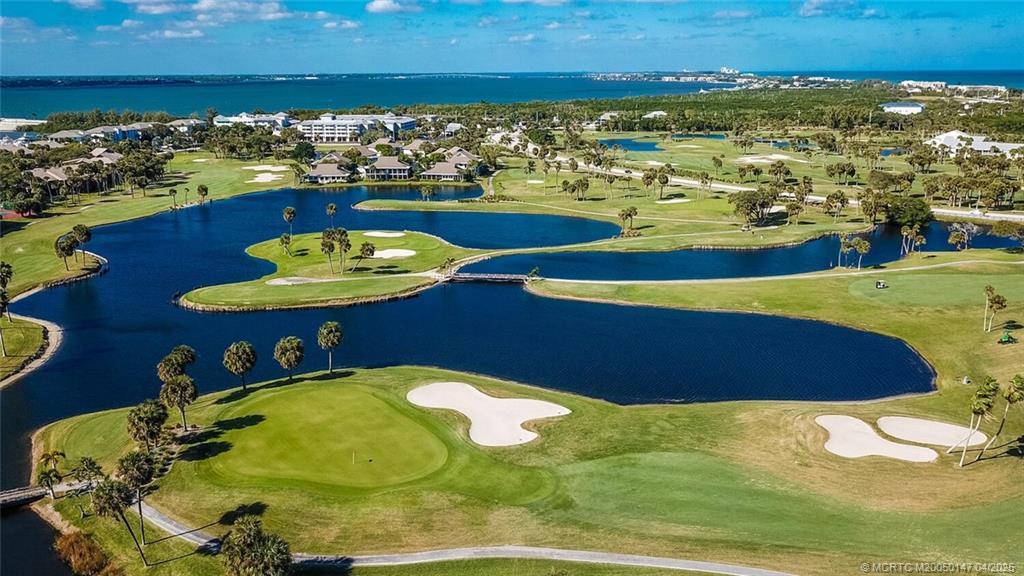 5811 Northeast Gulfstream Way, Unit 4002 Stuart, FL 34996 - Photo 38 of 39 a view of a swimming pool with an ocean view