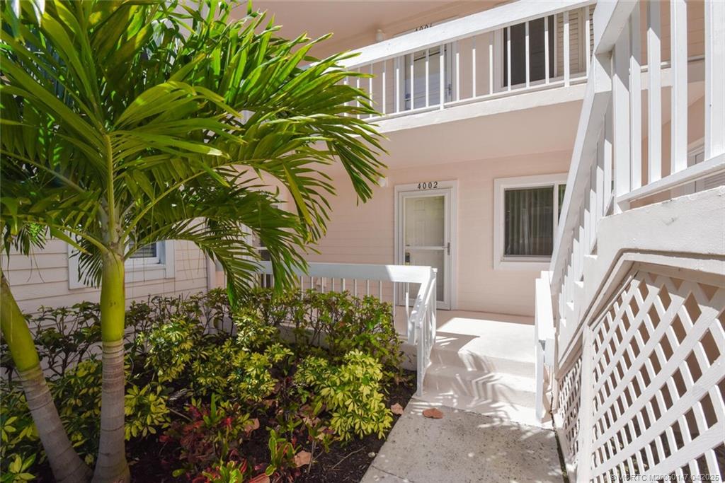 5811 Northeast Gulfstream Way, Unit 4002 Stuart, FL 34996 - Photo 6 of 39 a view of a house with a yard