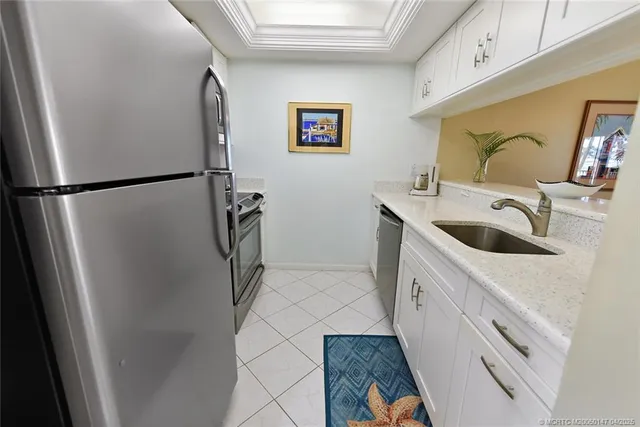 a bathroom with mirror on the sink