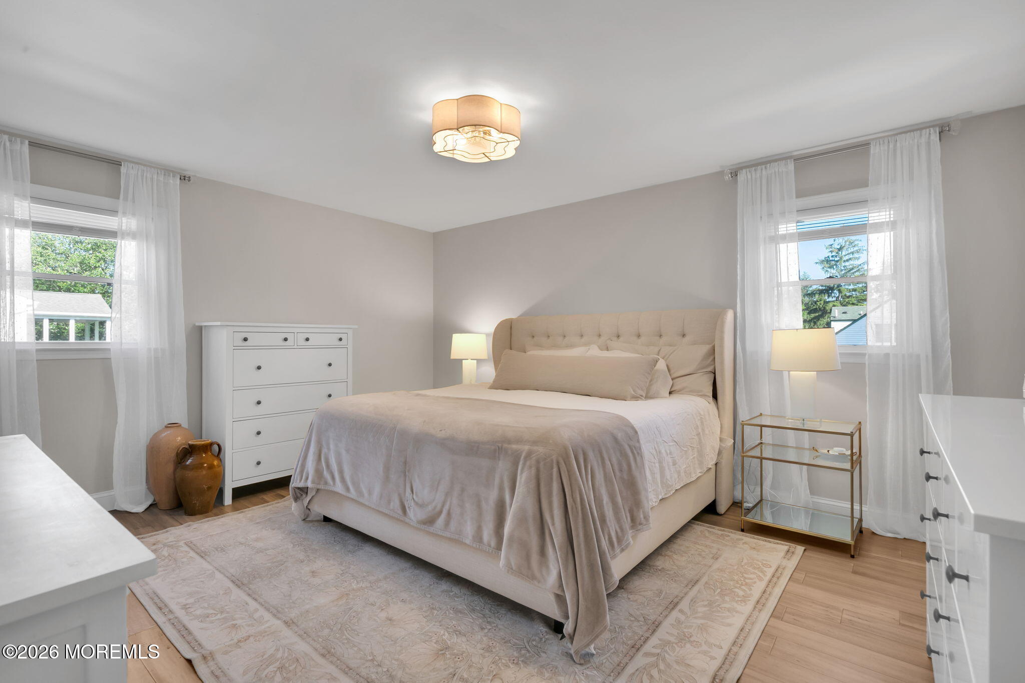 53 Field Avenue Red Bank, NJ 07701 - Photo 11 of 39 a bedroom with a bed and a chandelier