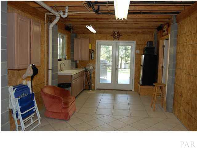 6510 River Bend Road Molino, FL 32577 - Photo 11 of 24 From garage door, you have a kitchen to the left. The downstairs bathroom/laundry room is to the right. This is not included in the square footage.