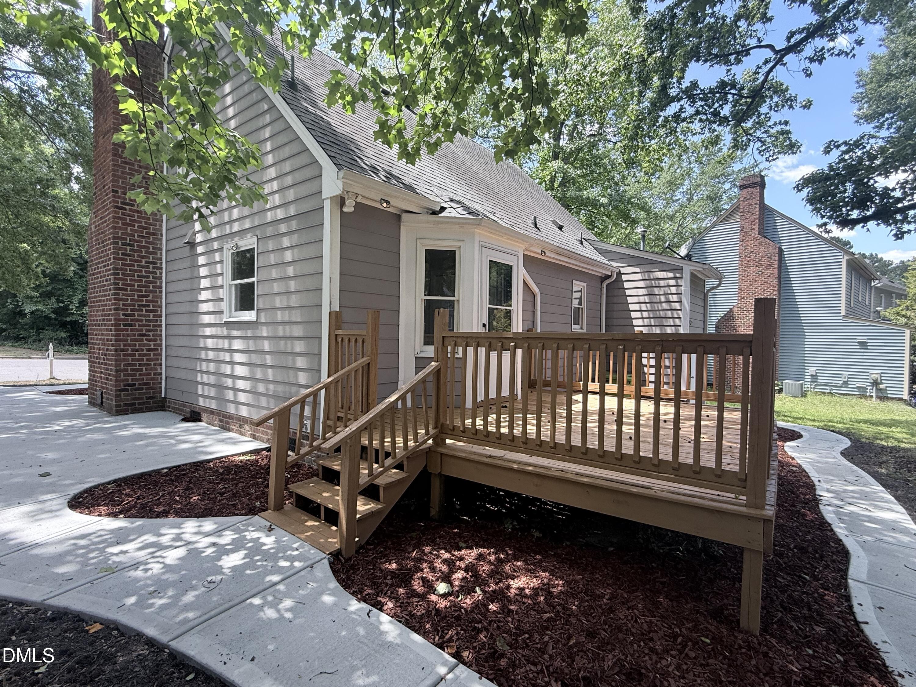 2900 Broadlands Drive Raleigh, NC 27604 - Photo 60 of 60 a view of a house with a small yard and wooden fence