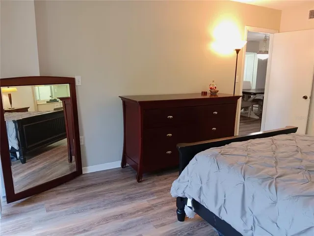 a bedroom with a bed and a fireplace