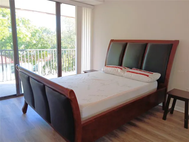 a bathroom with a granite countertop toilet sink and mirror