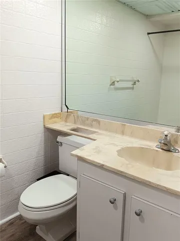 a view of a balcony with wooden floor