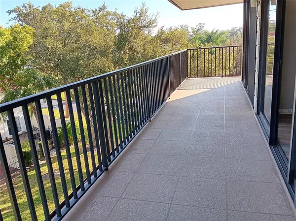 a view of a field with an ocean