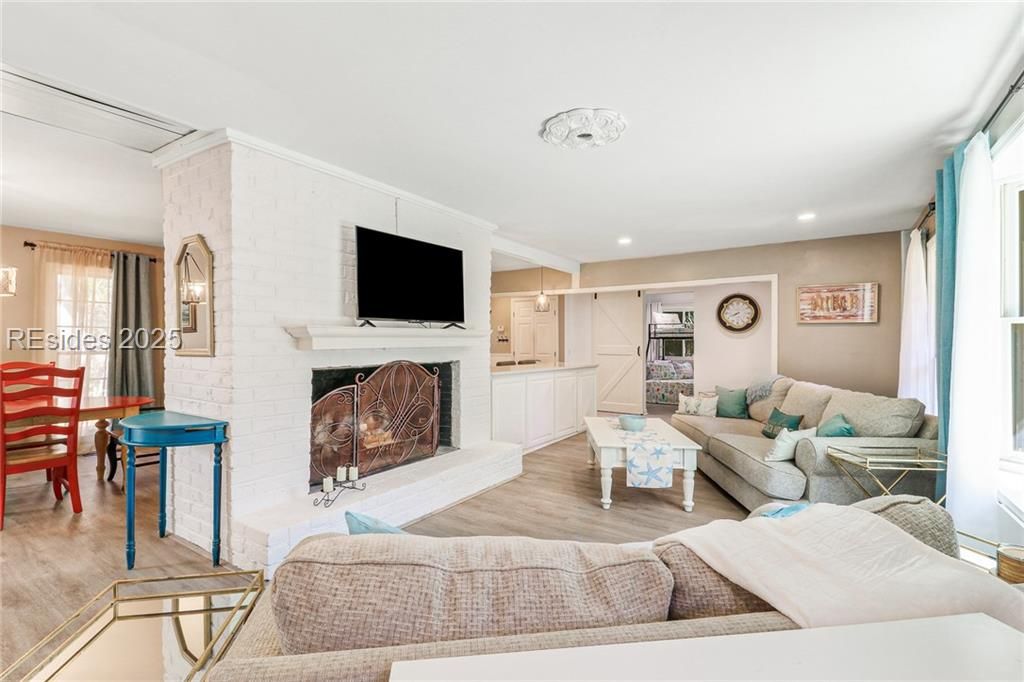 13 Mallard Road Hilton Head Island, SC 29928 - Photo 3 of 44 Open Living Area with a central fireplace focal po