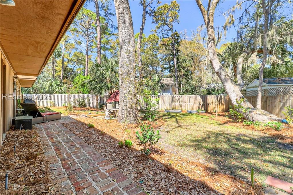 13 Mallard Road Hilton Head Island, SC 29928 - Photo 35 of 44 Path from patio to service yard and secondary back