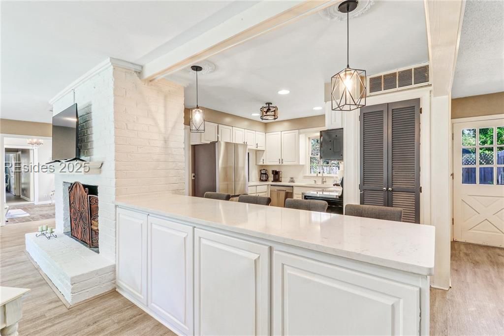13 Mallard Road Hilton Head Island, SC 29928 - Photo 6 of 44 Beautiful, updated light fixtures accent the kitch