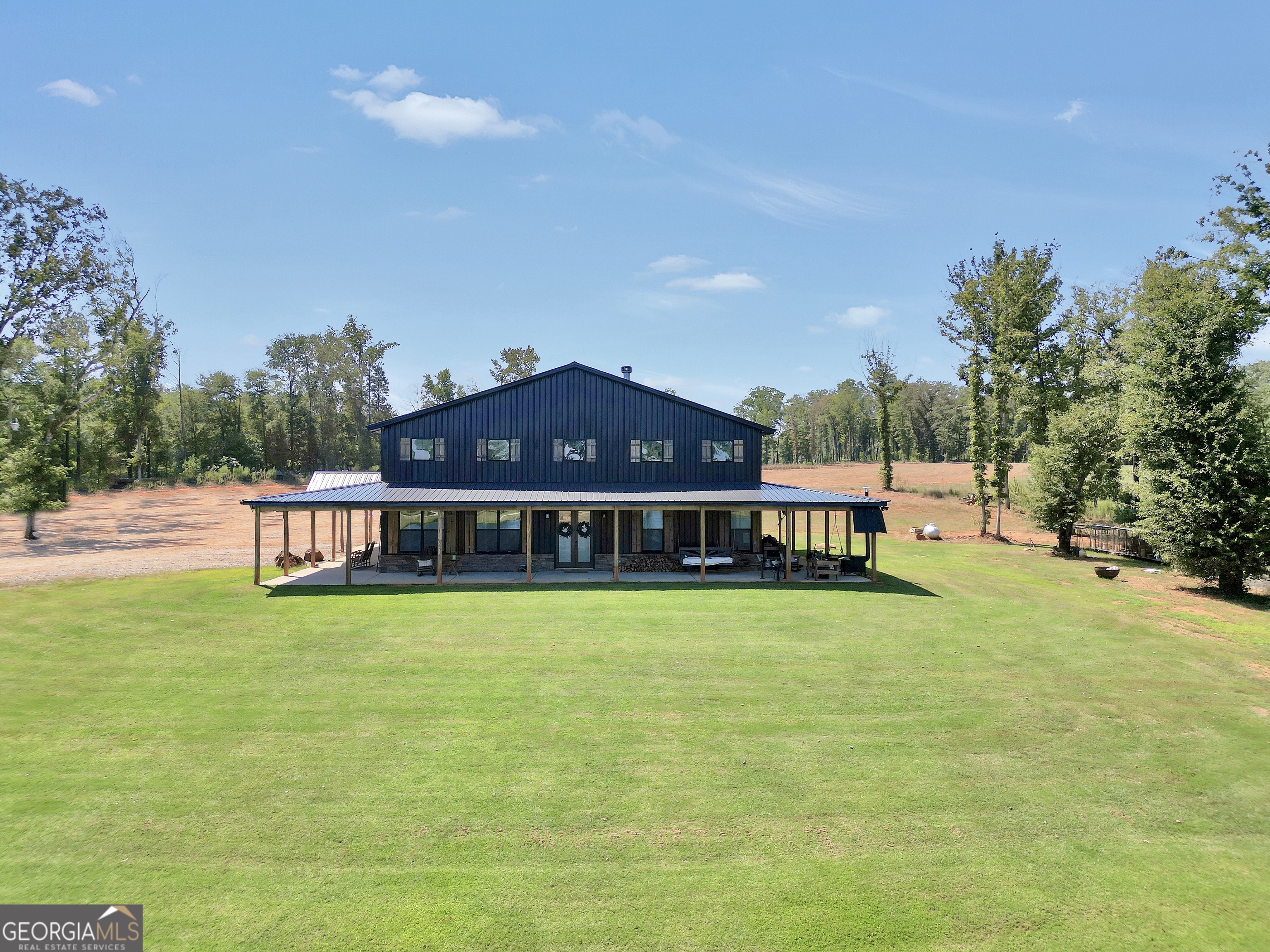 239 Walters Road Barnesville, GA 30204 - Photo 2 of 81 a front view of a house with a garden