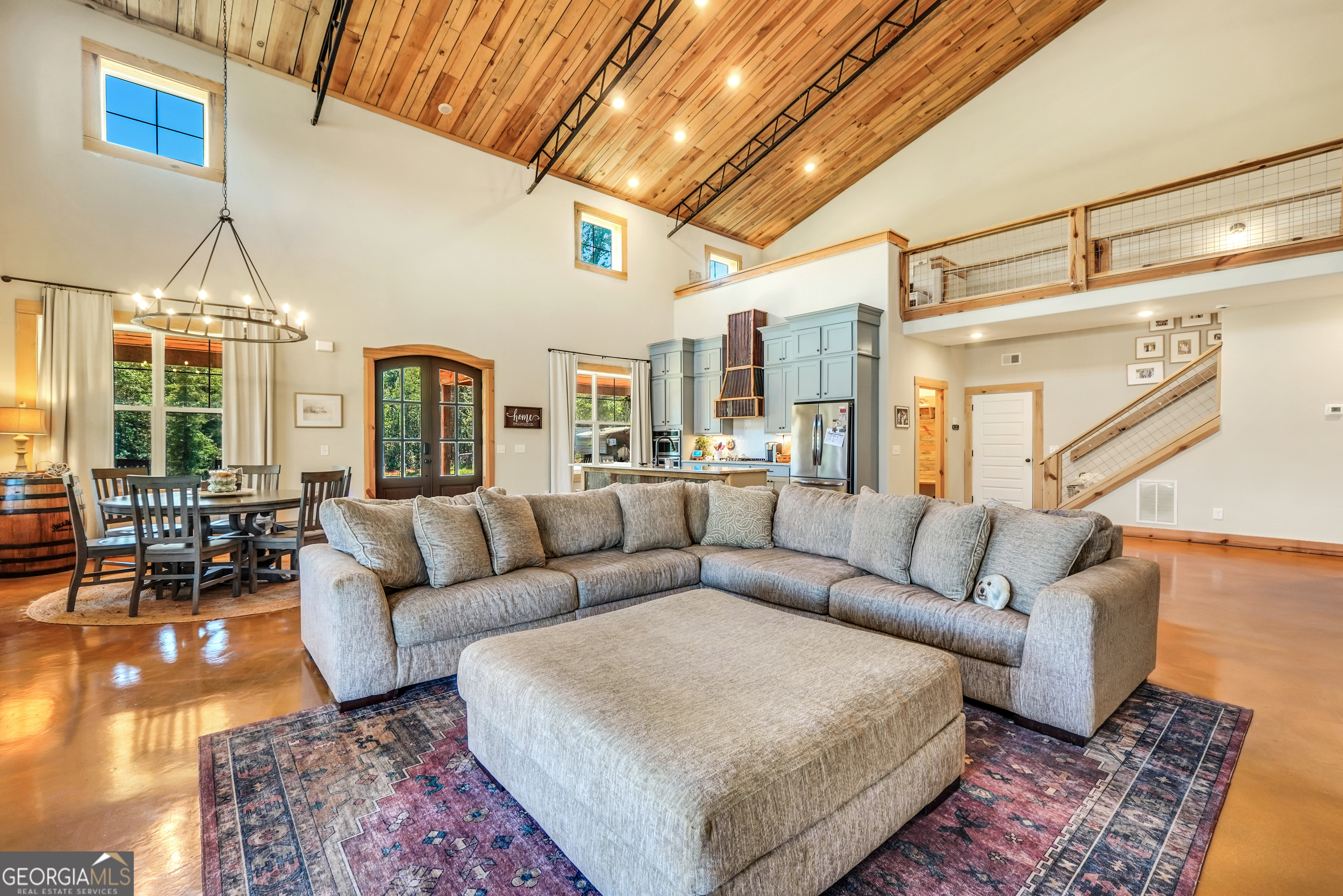 239 Walters Road Barnesville, GA 30204 - Photo 60 of 81 a living room with furniture and a chandelier