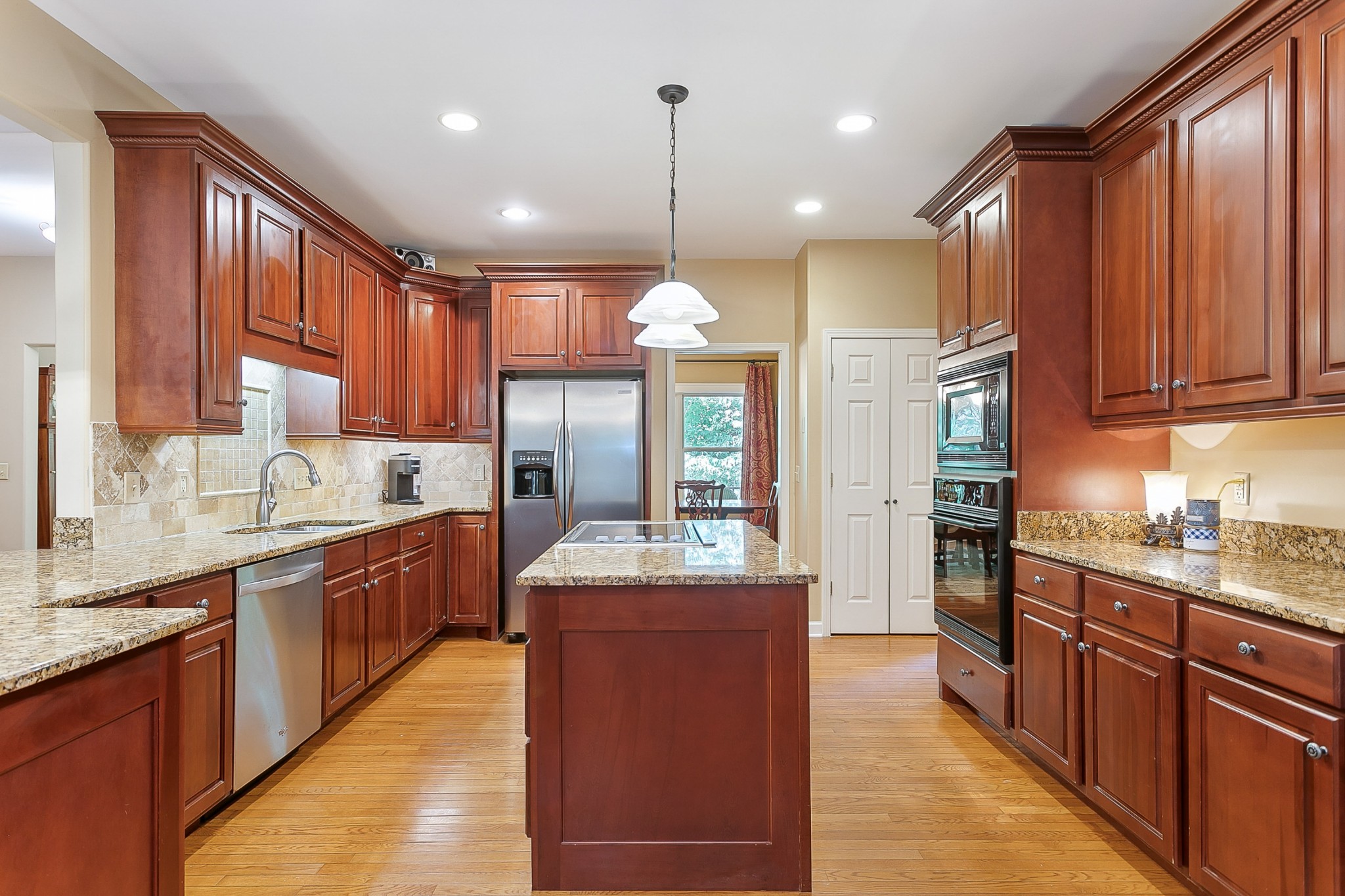 1441 Center Star Road Columbia, TN 38401 - Photo 17 of 62 a large kitchen with kitchen island granite countertop a large center island attached withe stainless steel appliances