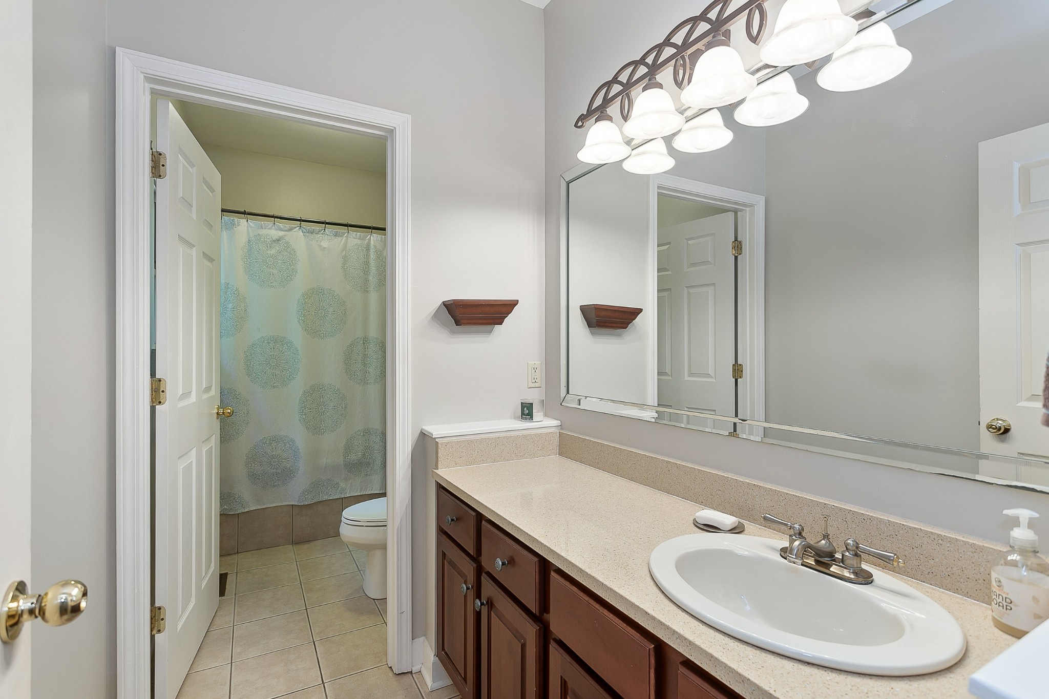 1441 Center Star Road Columbia, TN 38401 - Photo 33 of 62 a bathroom with a sink a toilet and a mirror