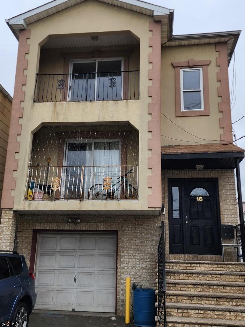 16 5th Street, Unit 2 Elizabeth Port, NJ 07206 - Photo 1 of 14 a view of building with front door