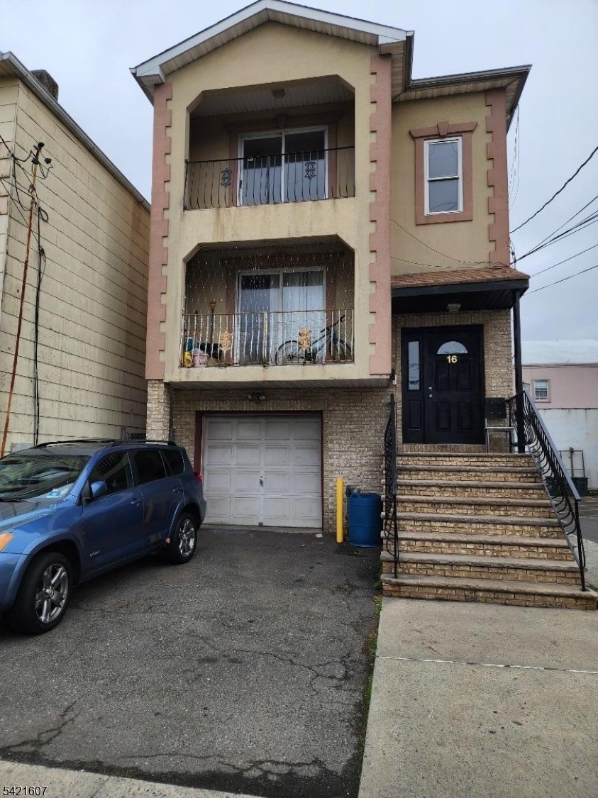 16 5th Street, Unit 2 Elizabeth Port, NJ 07206 - Photo 13 of 14 a view of a car parked in front of a house