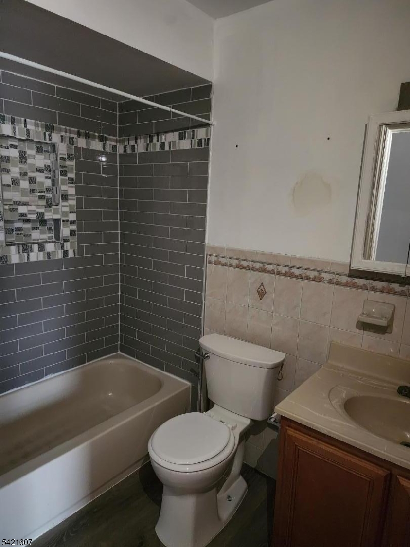 16 5th Street, Unit 2 Elizabeth Port, NJ 07206 - Photo 8 of 14 a bathroom with a sink a toilet and bathtub