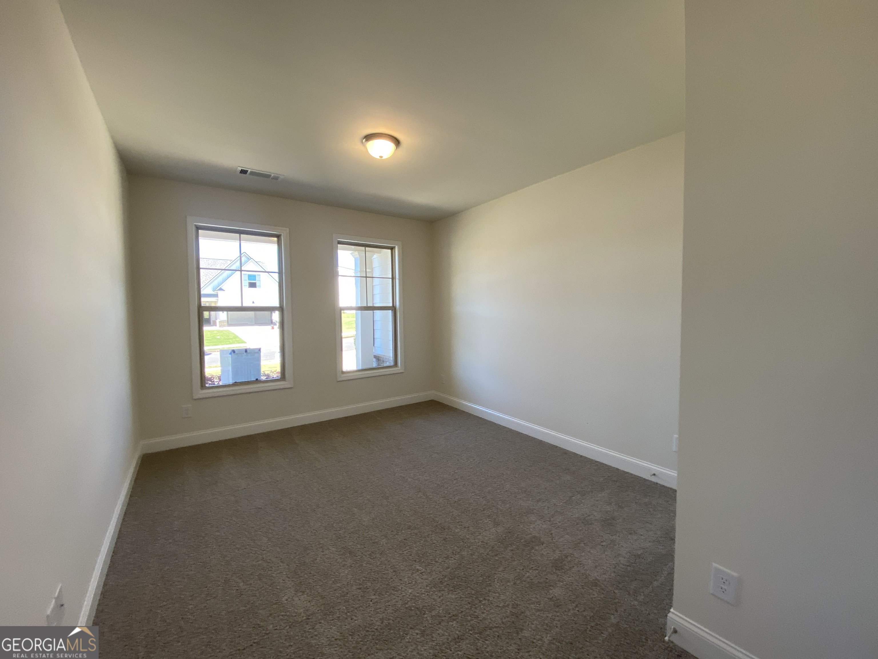174 Oakdale Road, Unit 34 Jefferson, GA 30549 - Photo 11 of 64 Guest bedrooms are separate from the primary suite. This bedroom has its own en suite. Your guest may never leave.