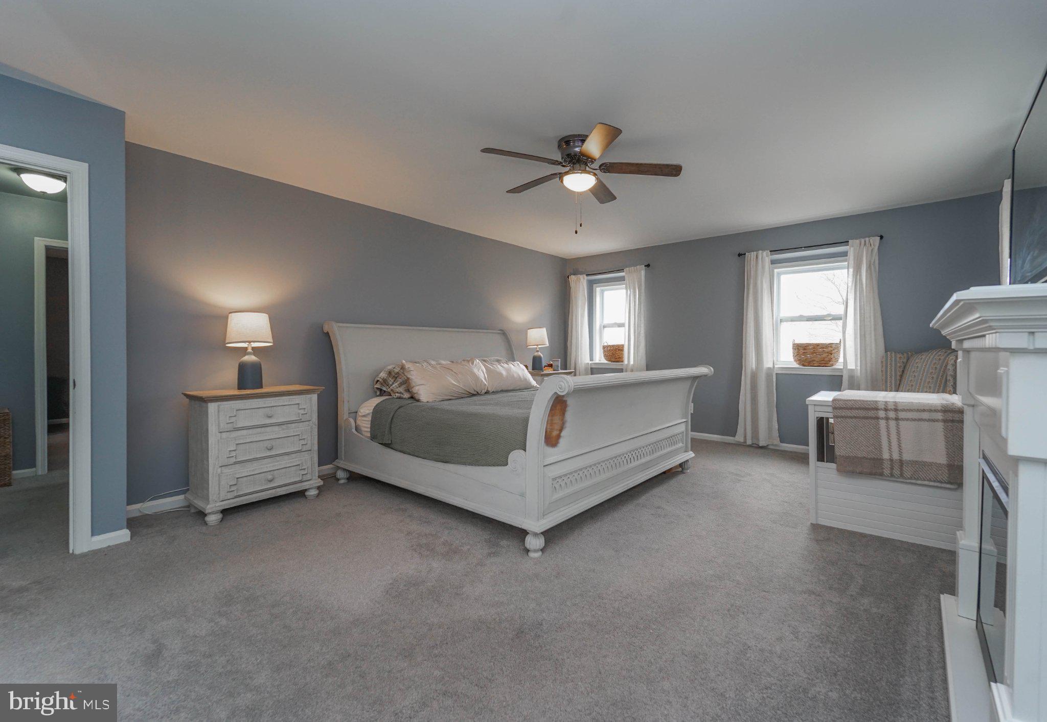 211 Queen Anne Road Stevensville, MD 21666 - Photo 28 of 33 Serene bedroom with soft hues.