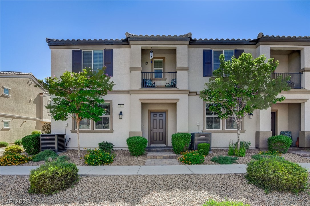484 Filaree Place Henderson, NV 89015 - Photo 1 of 71 This townhome features an inviting facade with lush landscaping and a private balcony.