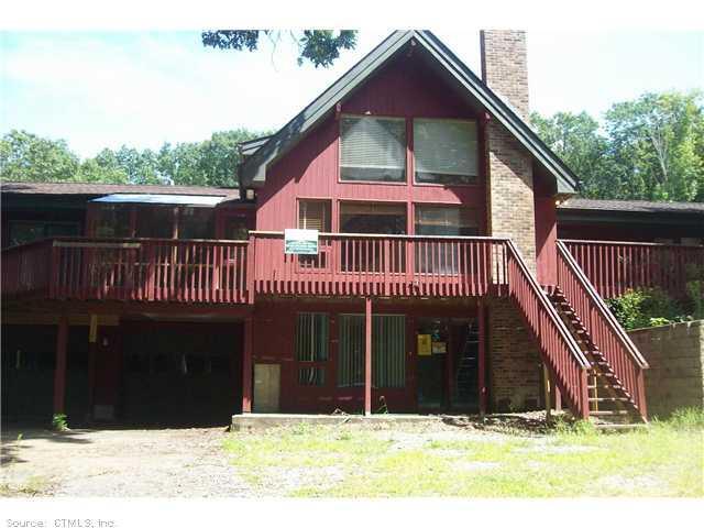 102 Goodwin Road Canterbury, CT 06331 - Photo 1 of 1 a front view of a house with balcony