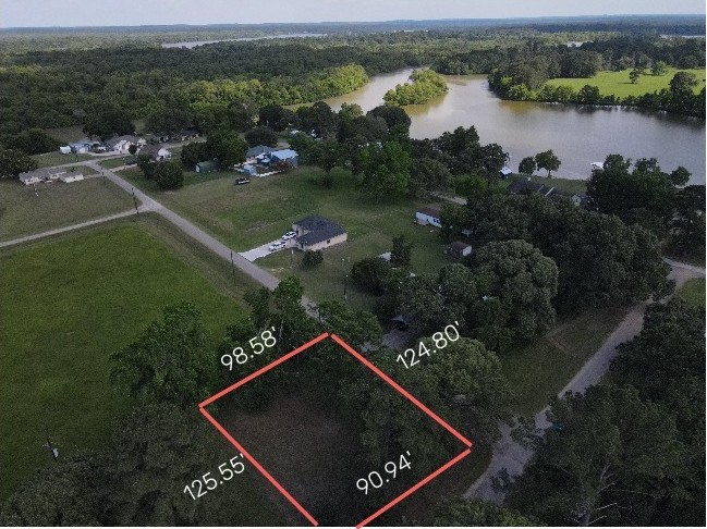 Lot 3 Hermitage Street Trinity, TX 75862 - Photo 1 of 8 an aerial view of lake and residential houses with outdoor space