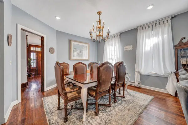 a view of a dining room with furniture and window