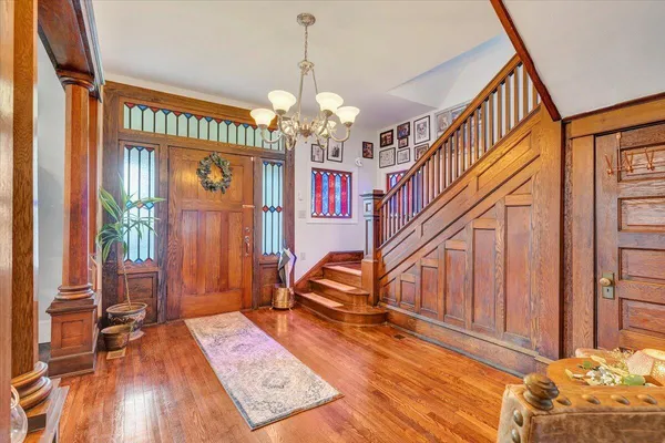 a living room with dining room and wooden floor