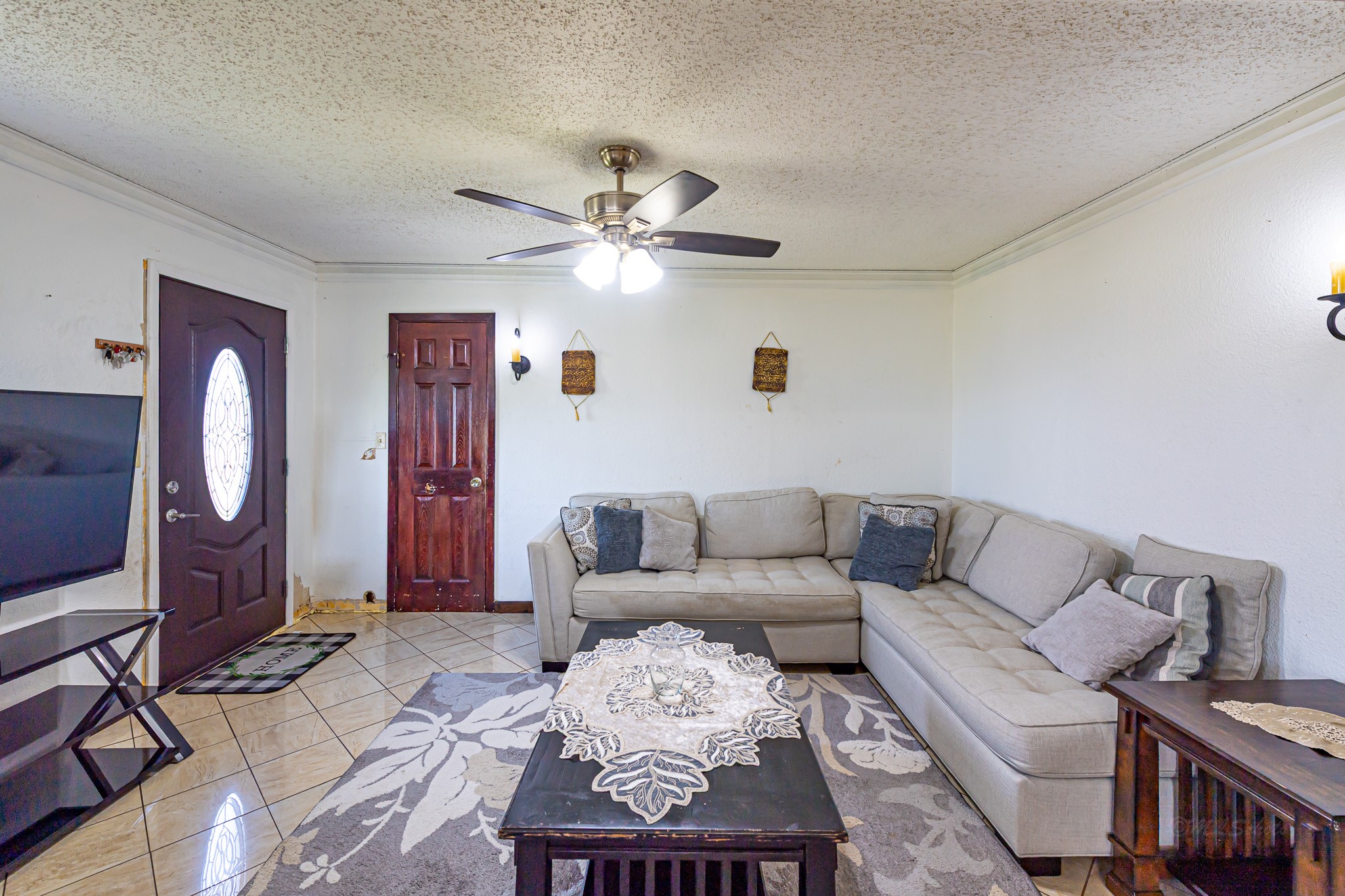 1195 Sens Road Sealy, TX 77474 - Photo 17 of 50 a living room with furniture a rug and a chandelier