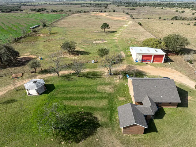 a aerial view of a house with outdoor space