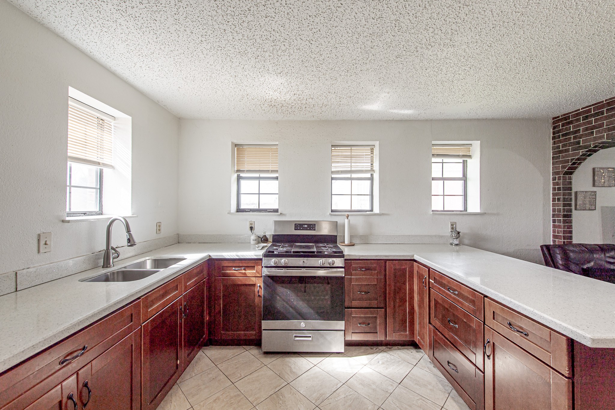 1195 Sens Road Sealy, TX 77474 - Photo 23 of 50 a kitchen with a sink stove and cabinets