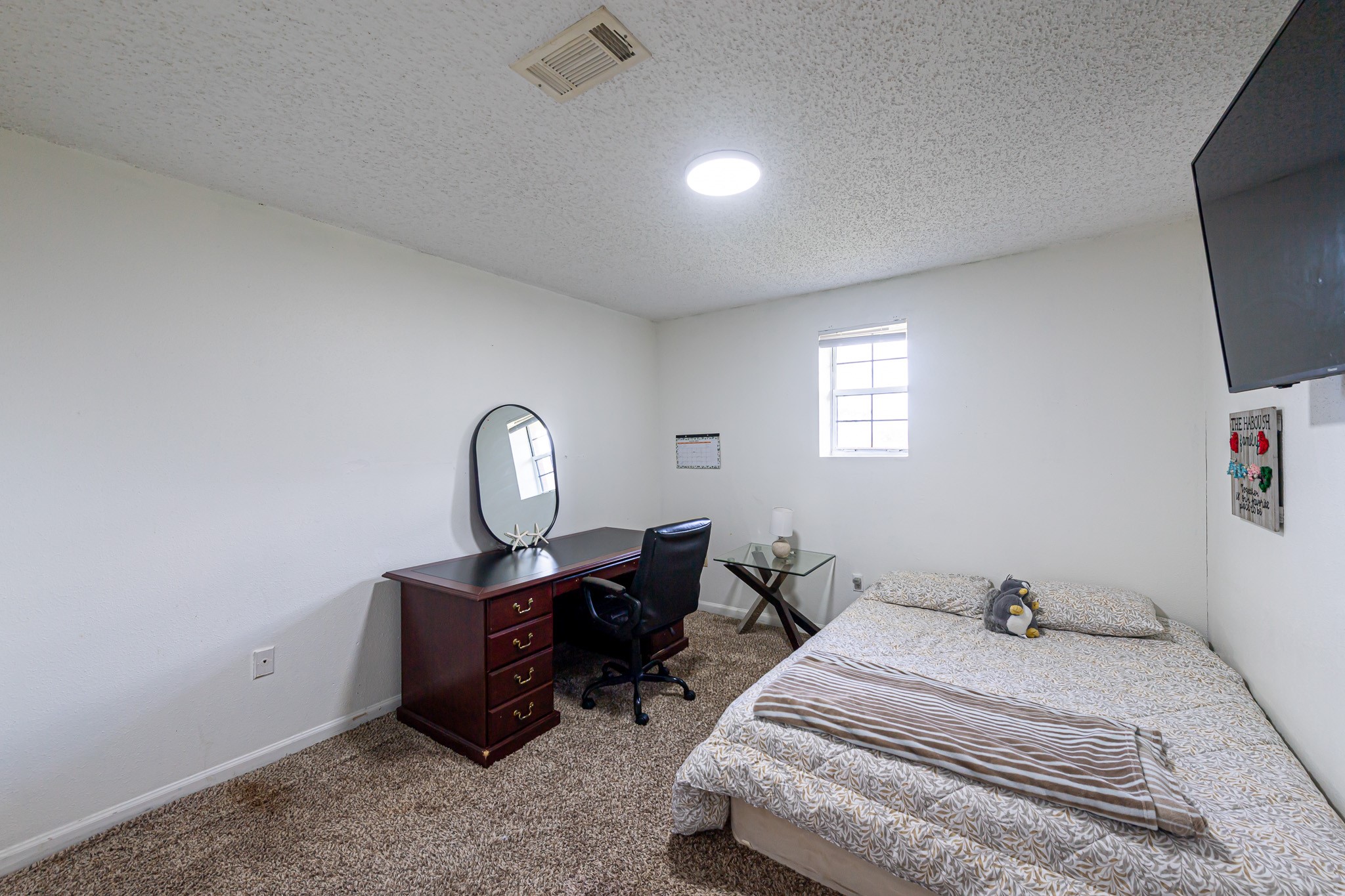 1195 Sens Road Sealy, TX 77474 - Photo 28 of 50 a bedroom with bed and a window