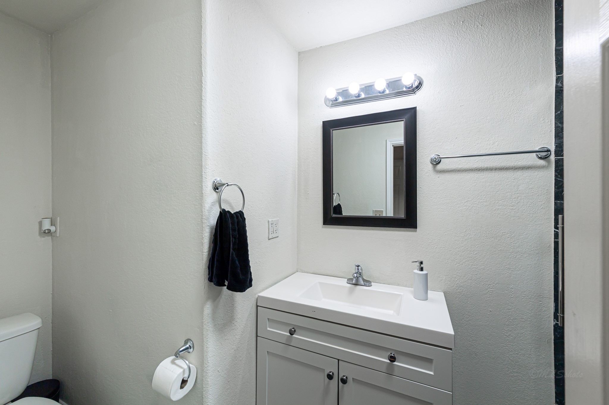 1195 Sens Road Sealy, TX 77474 - Photo 31 of 50 a bathroom with a sink vanity and toilet