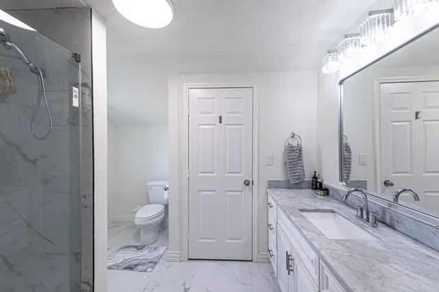 an aerial view of a houses with outdoor space