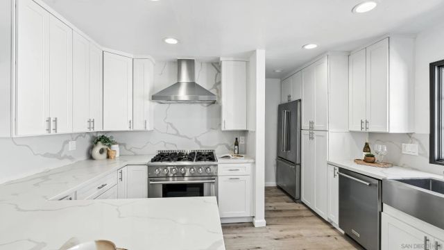 a kitchen with a table and chairs
