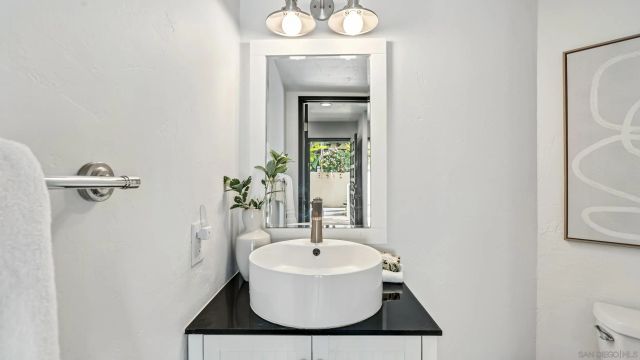 a large bed sitting in a bedroom next to a window