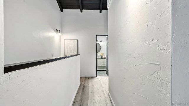 a view of a house with a small deck