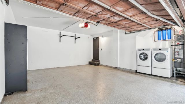 front view of a house with swimming pool and sitting area